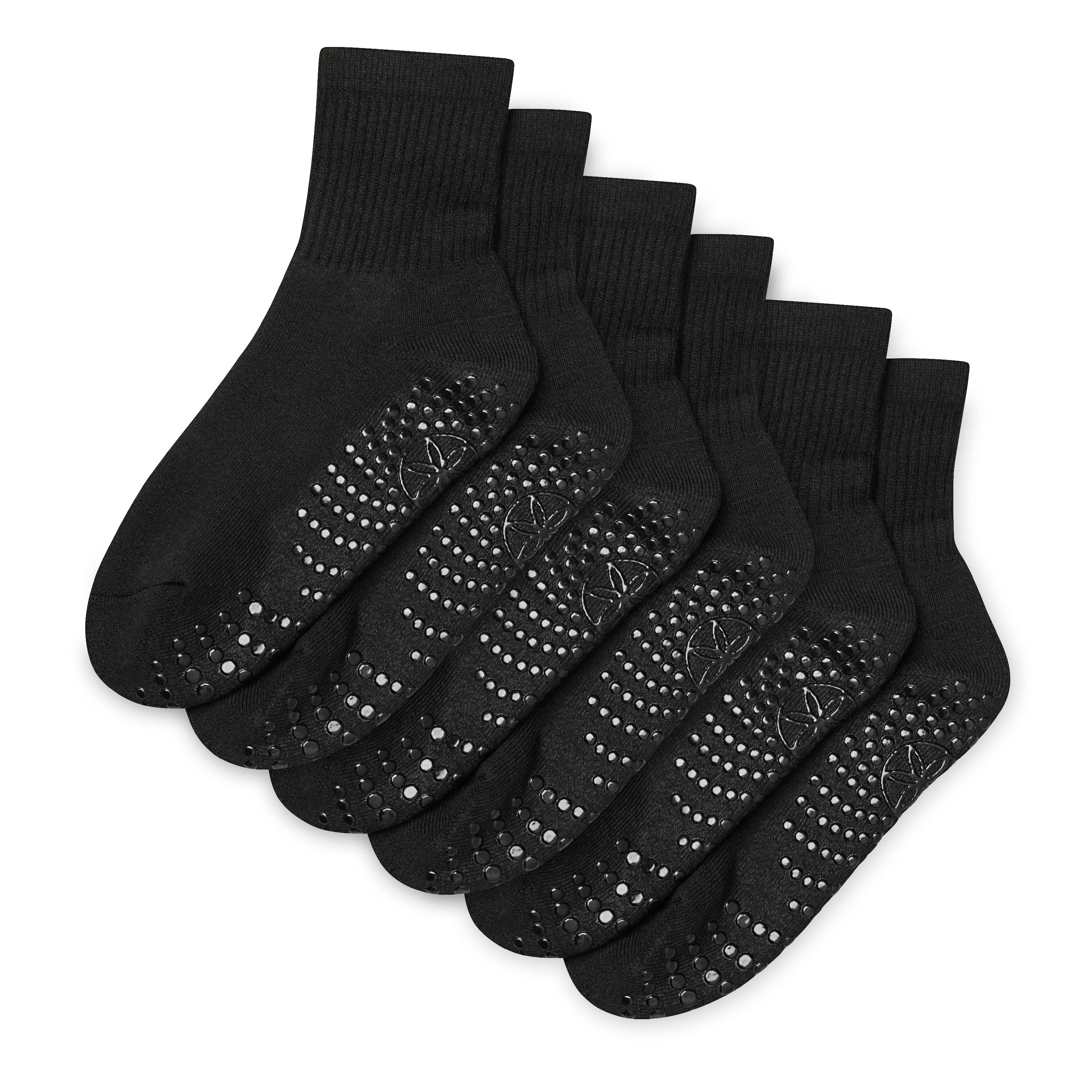 Set of black socks with textured sole on a white background